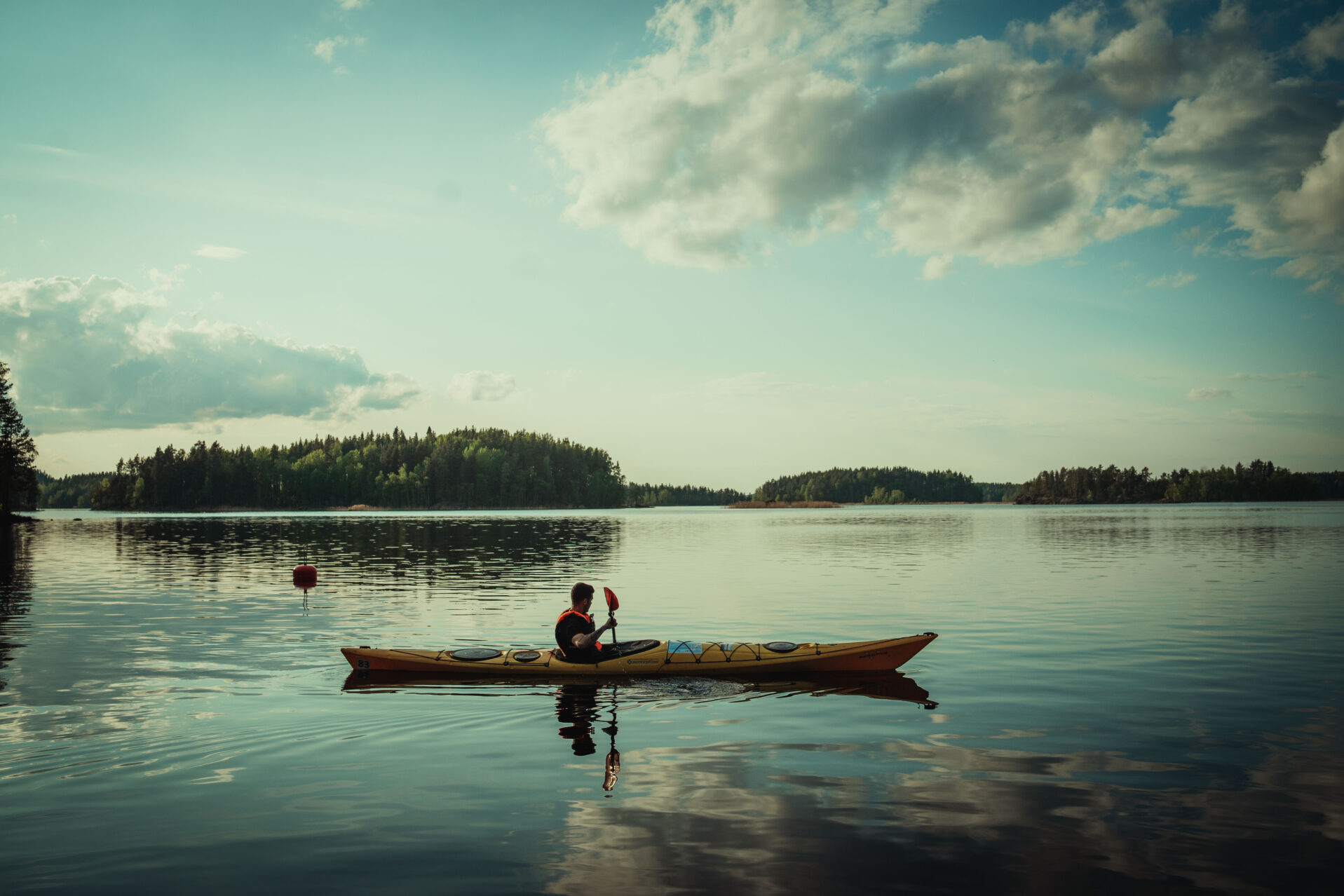 single kayak on calm water in Linnansaari National Park