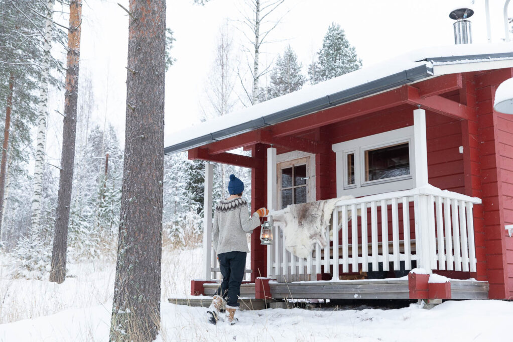 Traditional wood heated sauna in winter landscape