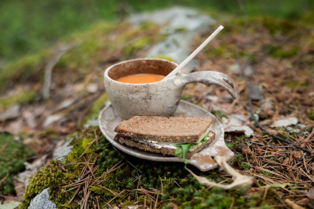 Rye bread and soup in a kuksa cup